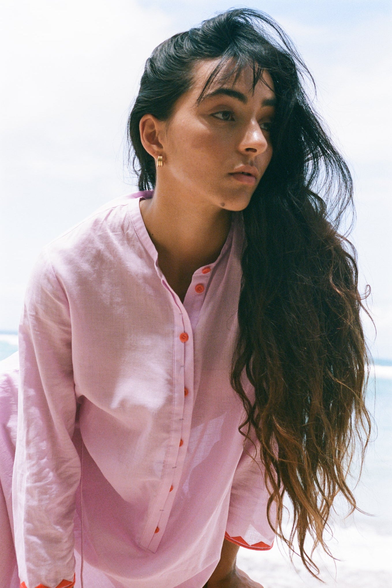 LILLY PILLY woman in a orchid Callie cotton dress standing with a blurred background